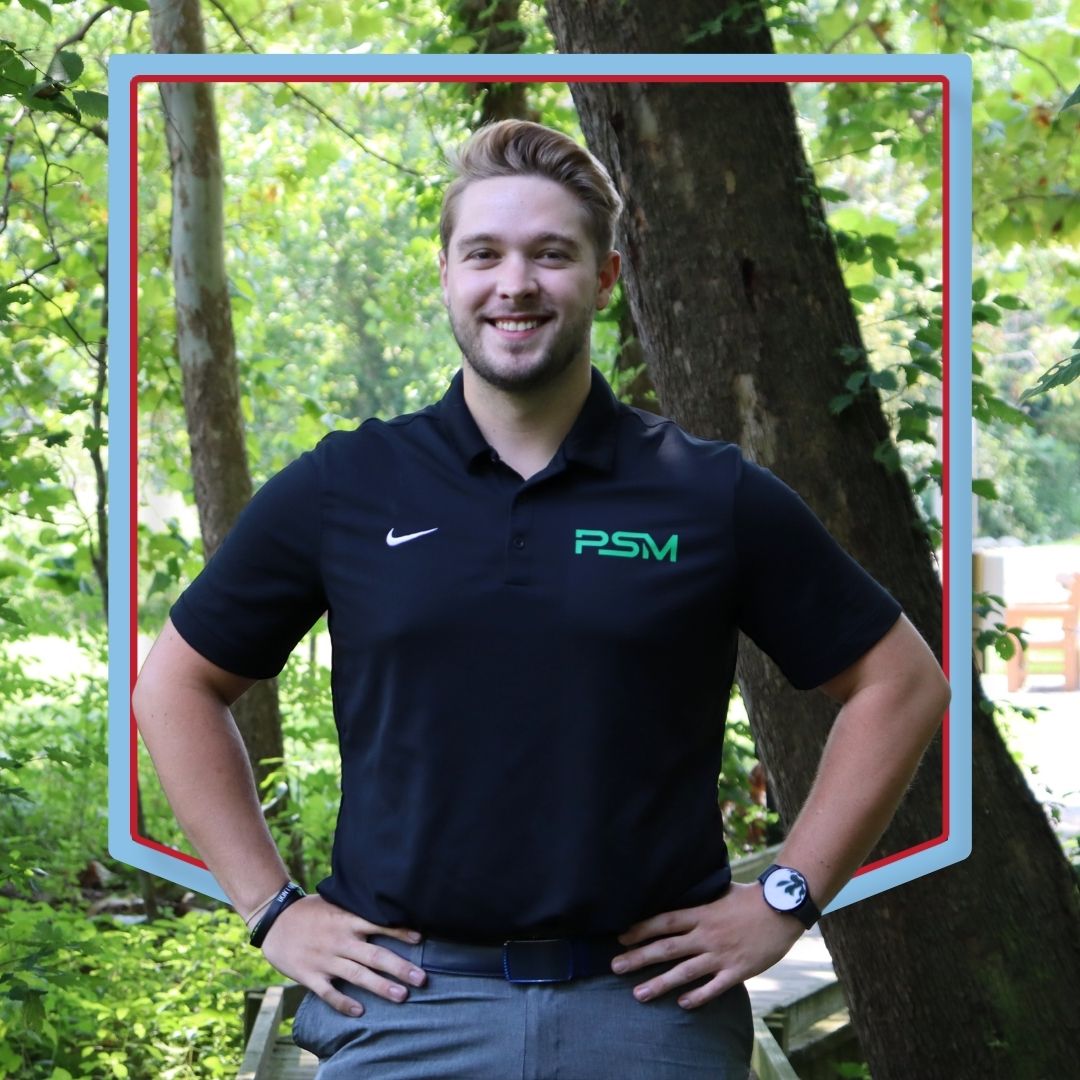 Michael Kurtz poses wearing a Parkview Sports Medicine branded shirt with a wooded background.